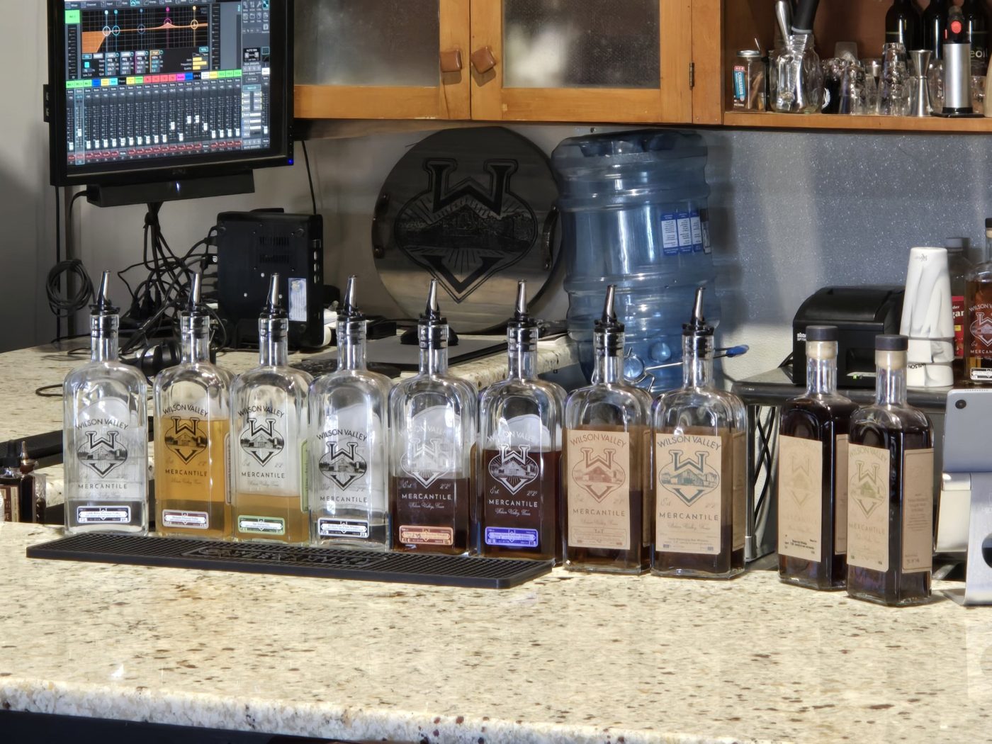 Wilson Valley bottles on the back bar